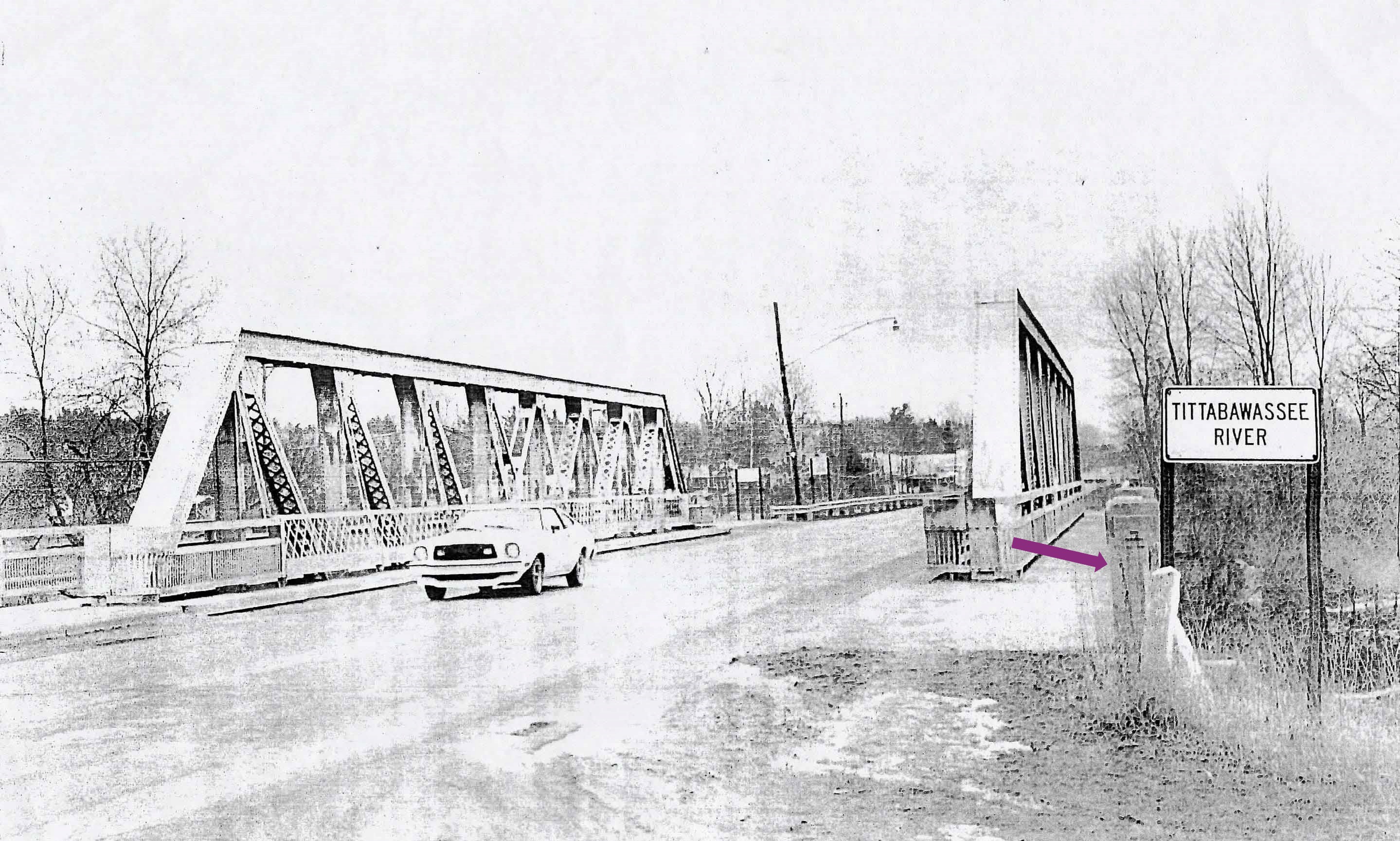 A car crosses the bridge.